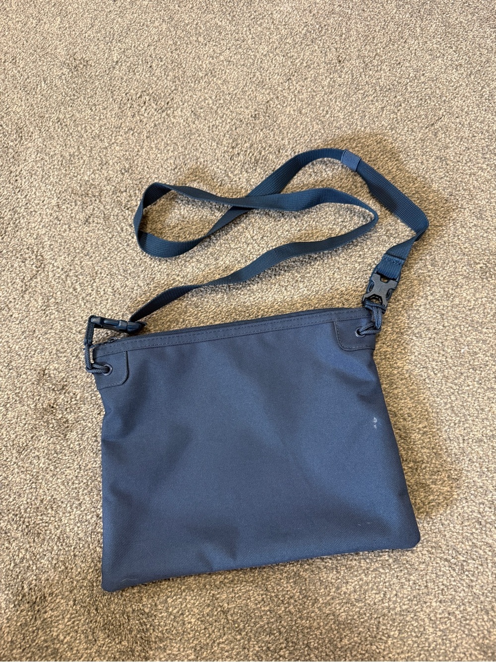 Herschel navy blue crossbody bag with red/white striped lining - Picture 2 of 3